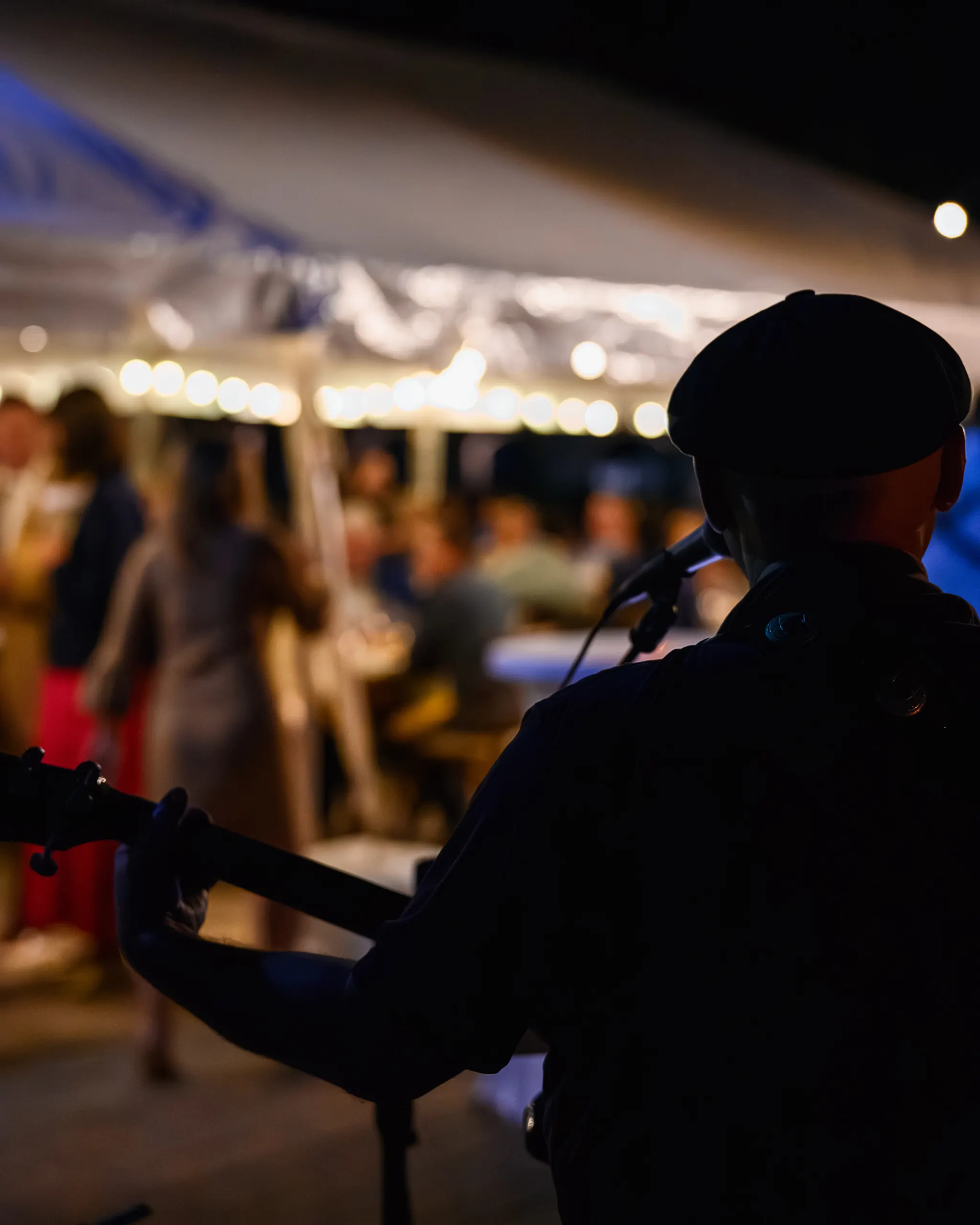 Solo musician performing on guitar with vocals