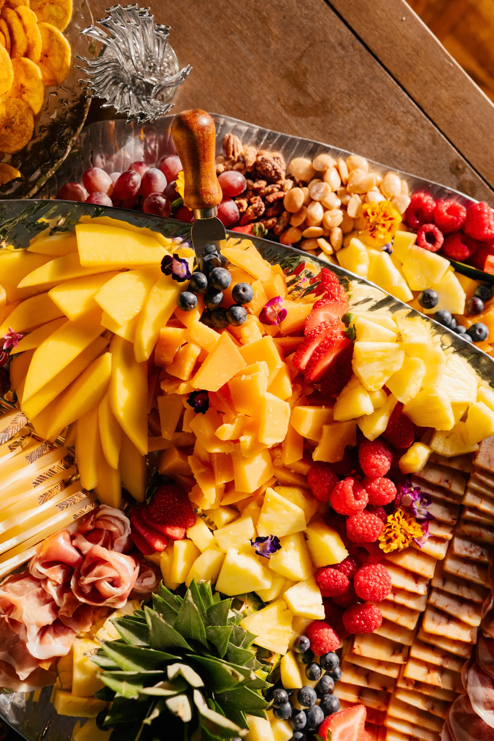 Fresh fruits and cheese display at the San Marco Centennial Soirée