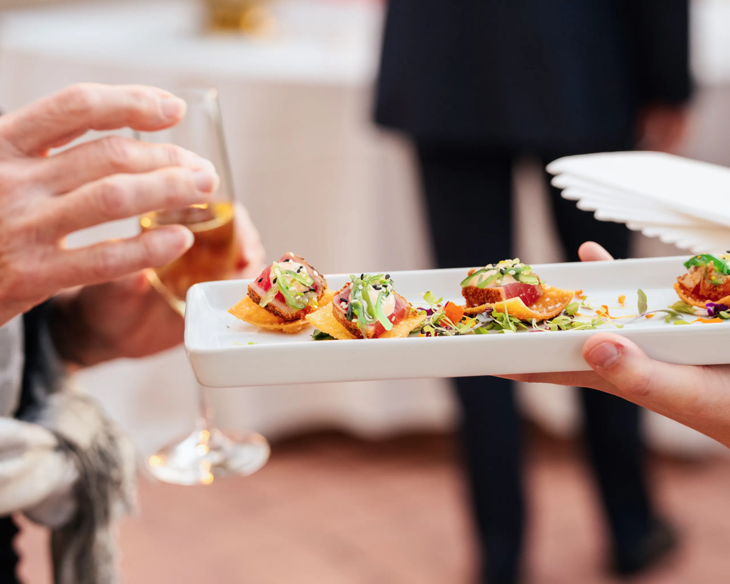 VIP guests greeted by waitstaff at the San Marco Centennial Soirée